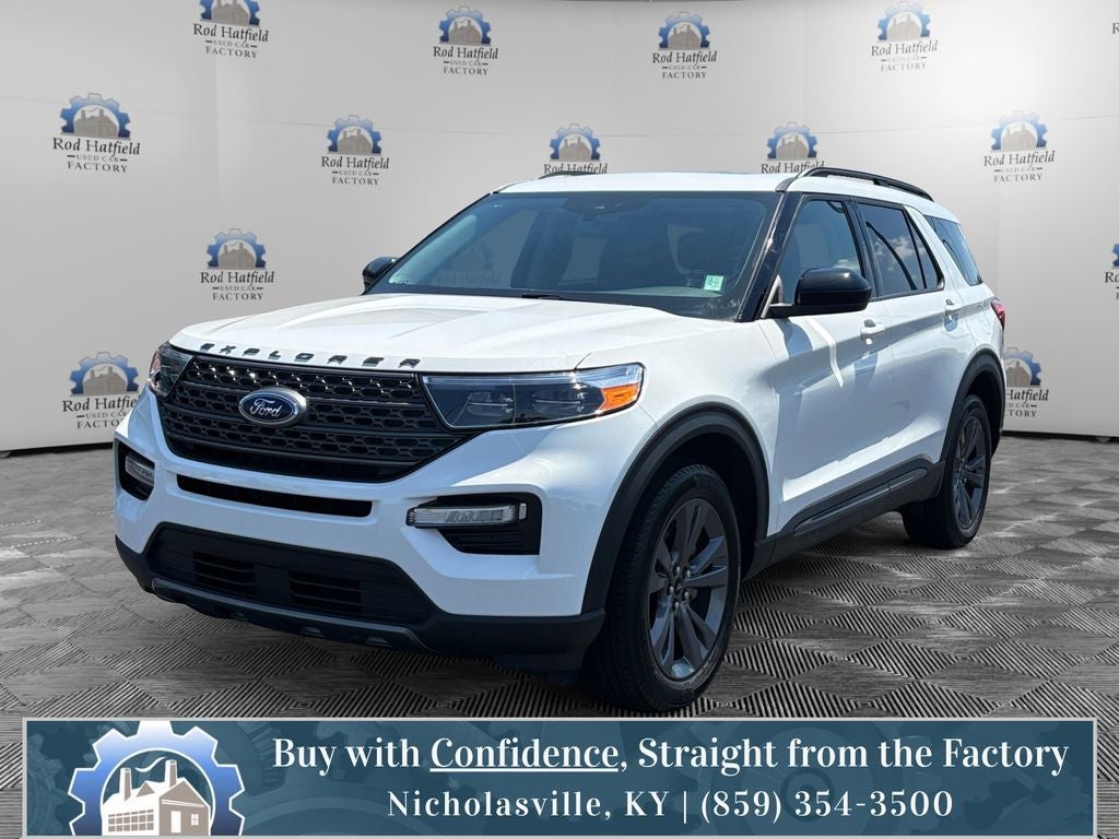 2023 Ford Explorer XLT in Star White Metallic Tri-Coat — front three-quarter view