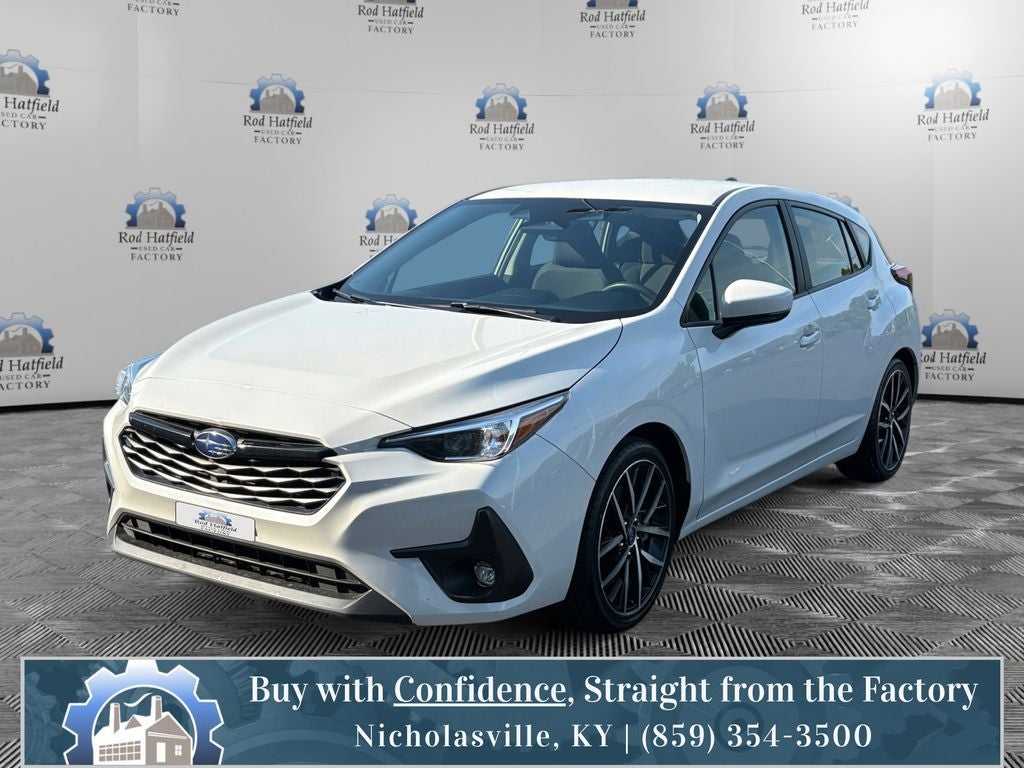 2024 Subaru Impreza Sport in Crystal White Pearl — front three-quarter view