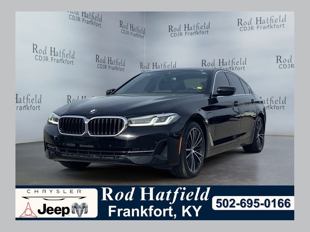 2021 BMW 530e 530e iPerformance in Jet Black — front three-quarter view